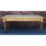 A Victorian style pine country kitchen table, the top with a moulded edge, on turned legs,
