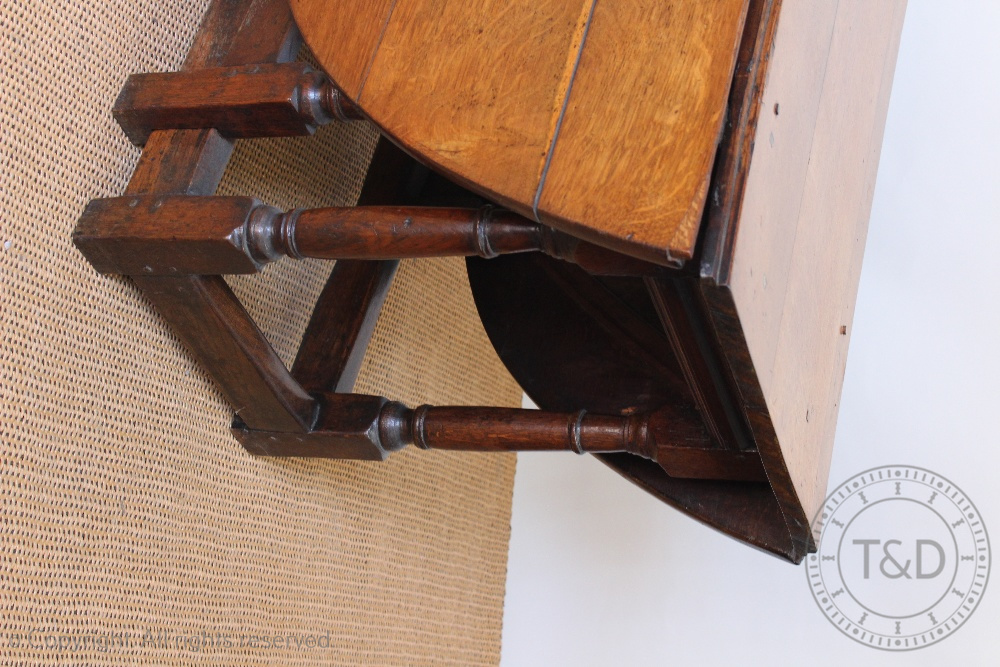 An early 18th century oak gate leg table, with moulded detailing, on turned and block legs, - Image 2 of 2