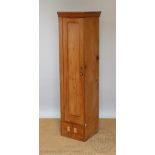 An early 20th century pine gun cupboard,