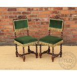 A pair of Victorian carved oak hall chairs,