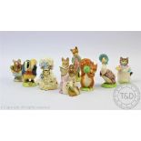 A collection of nine Beatrix Potter figures, comprising Squirrel Nutkin, Tailor of Gloucester,