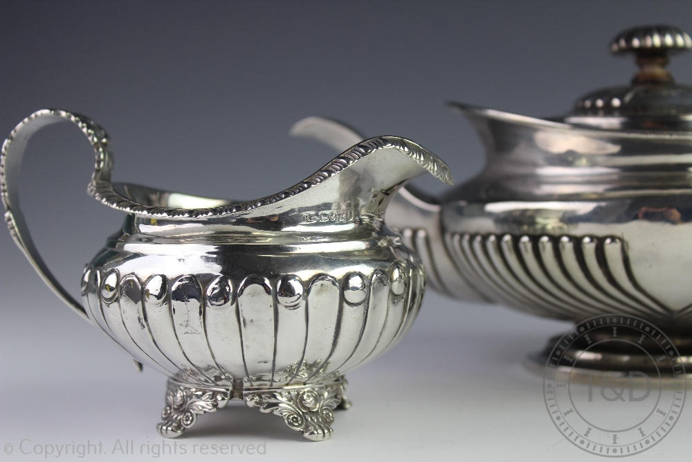 An assembled three piece silver tea service, each piece of low rounded form, with fluted detail, - Image 3 of 3