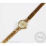 An Omega 9ct gold ladies wristwatch, London 1963, the circular silvered dial with batons,