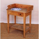 An Edwardian pine wash stand, with three quarter back above a drawer and under tier,