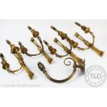 A set of four Regency style gilt brass twin branch wall lights,