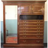 An Edwardian mahogany wardrobe, with moulded cornice and mirrored door, with two cupboard doors,