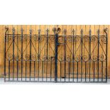 A pair of cast and wrought iron garden gates, with scroll detailing, each gate is 124.