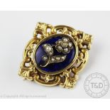 A mourning brooch, designed as a blue enamelled oval panel,