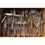 A collection of silver plated knives, mostly reeded,