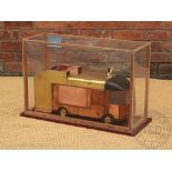 A steampunk scratch built lorry within glazed case,