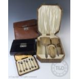 A George V silver Art Deco four piece dressing table set within fitted case,
