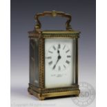 A late 19th century lacquered brass carriage time piece,