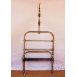 An Edwardian childs brass frame half tester bed,