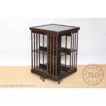 An Edwardian oak revolving bookcase,