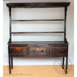 A George III and later oak high back dresser,