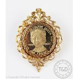 A Queen Elizabeth Queen Mother, Manx One Crown dated 1980, within a 9ct gold brooch setting,
