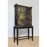A Chinoiserie lacquered cabinet on later stand, 19th century and later,
