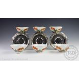 A set of six silver mounted Japanese porcelain teacups and six silver saucers,