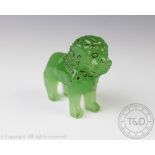 A green glass lion in the Chinese style,