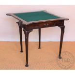 A George II style mahogany card table, with rounded corners, on tapered legs and pad feet,