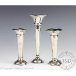 A pair of Edwardian silver posy vases, Boots Pure Drug Company, Birmingham 1907,