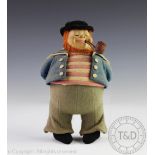 A Norah Wellings type felt sailor/ Jack Tar, modelled standing smoking a pipe, typically dressed,