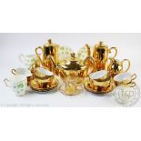 A set of six Bavarian tea cups and saucers with gilt detailing,