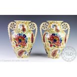 A pair of Fisher of Budapest twin handled vases,