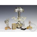 A Jewish silver plated menorah, with eight branches beneath a scene of Jerusalem,