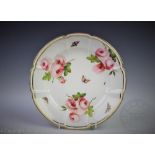 A Swansea porcelain moulded plate, painted with three sprays of roses and insects,