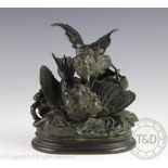 After Jules Moigniez (French 1835-1894), a bronze group of two fighting sparrow, on oval base, 18.