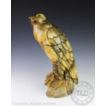 An early 20th century continental carved alabaster model of a bird of prey,