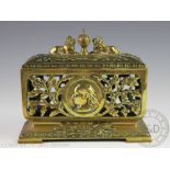 A Queen Victoria 1887 Jubilee commemorative brass box, with pierced floral detailing throughout,