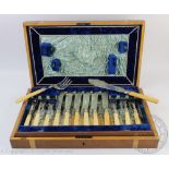 A Victorian cased canteen of ivory handled fish knives and forks (12+12) and servers,