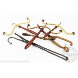 Three Victorian mahogany handled and brass mounted wig holders,