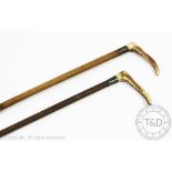 Two silver mounted riding crops,