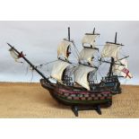 A wood model of a galleon, with painted gilt detailing,