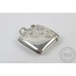 A George V silver vesta case T H Hazelwood and Co, Birmingham 1911, with floral chasing detail,