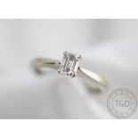 A diamond solitaire ring,