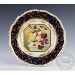An early 19th century Bloor Derby porcelain plate, painted with a central panel of fruit,