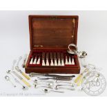 A cased set of twelve mother of pearl handled and silver collared fruit knives and forks,