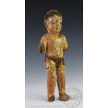 An 18th century continental carved wood and gesso figure of the infant Christ,
