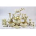 A selection of Belleek China including a tree trunk spill vase, 16.
