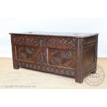 A late 17th century and later oak coffer, with hinged top and double panelled front, on stile feet,