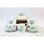 A Shelley twenty one piece tea service, decorated with forget me nots,