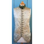 A George III Gentlemans silk waistcoat, twelve button, embroidered throughout with floral sprigs,