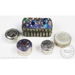 Three silver pill boxes including an Egyptian revival example,