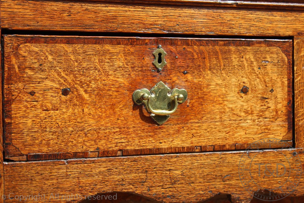 An 18th century Shropshire oak dresser base, with three drawers above a serpentine apron, - Image 3 of 4