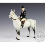 A Beswick hunts woman on dapple grey hunter, 21.