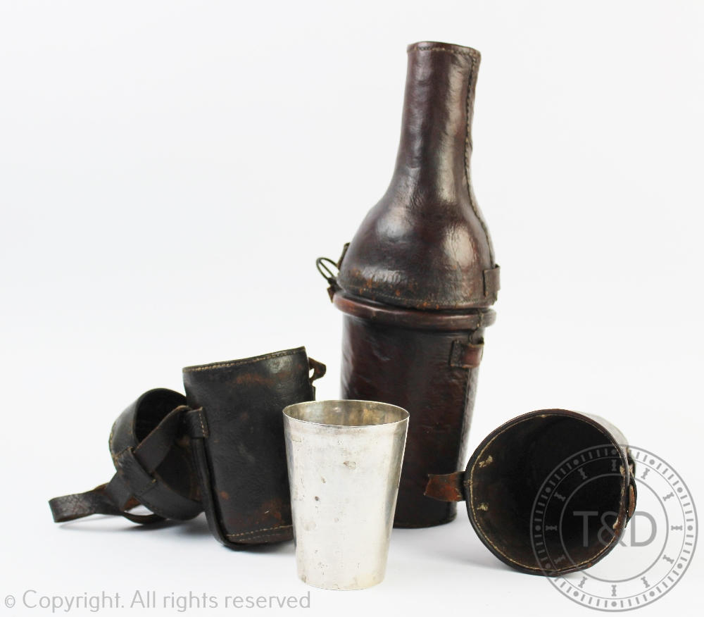 A 19th century vintage leather bottle case and cover and green glass wine bottle,